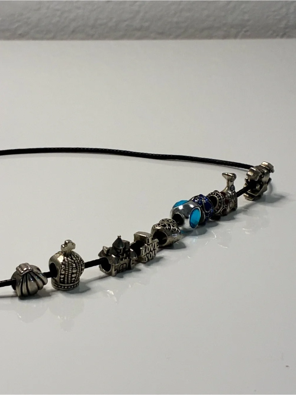 Black Cord Necklace with Silver Travel Themed Chunky Charms Blue and Red Accents